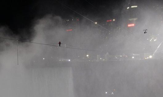 Nik Wallenda walks across the Niagara Falls in an attempt to be the first man ever to complete the walk