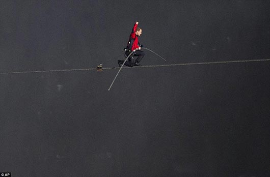 Nik Wallenda walks across the Niagara Falls in an attempt to be the first man ever to complete the walk