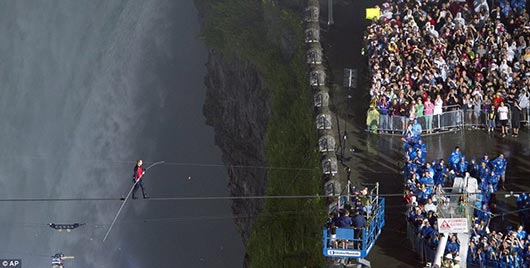 Nik Wallenda walks across the Niagara Falls in an attempt to be the first man ever to complete the walk