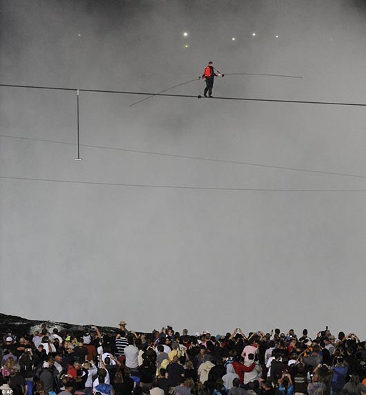 Nik Wallenda walks across the Niagara Falls in an attempt to be the first man ever to complete the walk