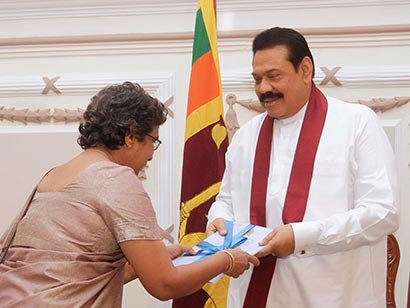 14th Population and Housing Census handed over to President Mahinda Rajapaksa by Superintendent of Census and Director General of Census and Statistics, Mrs Suranjana Vidyaratne at Temple Trees