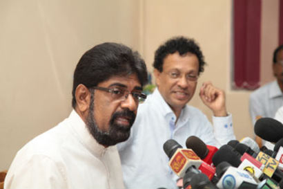 Minister Keheliya Rambukwella with Mr. Ariyaratna Atugala