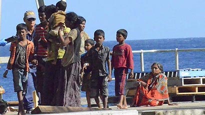 Refugees from Sri Lanka arrive for processing at Christmas Island last month