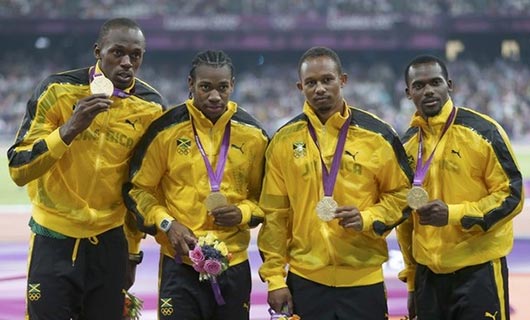 Usain Bolt, Yohan Blake, Michael Frater and Nesta Carter of Jamaica celebrate after winning gold and setting a new world record of 36.84 during the Men's 4 x 100m Relay Final on Day 15 of the London 2012 Olympic Games at Olympic Stadium on August 11, 2012 in London, England.