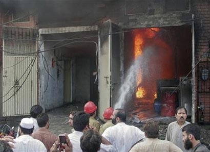 Pakistan factory fires kill 125 workers