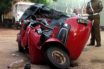 Three dead after three-wheeler collides with truck