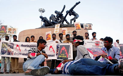 Members of the Students’ Federation of India staging a silent protest for the cause of Lankan Tamils near Labour Statue on the Marina Beach