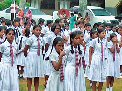 Students of Ibbagamuwa Central College were made to listen to a speech by Minister of Education, Bandula Gunawardena, whilst standing outdoors during heavy rain.