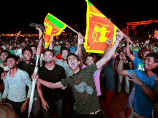 Sri Lanka cricket fans celebrate in Colombo during the T20 world championship team's victory procession