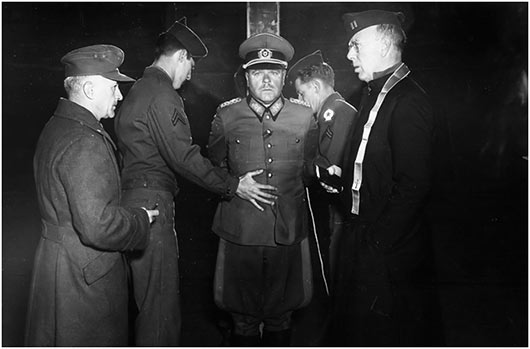 German Wehrmacht General Anton Dostler is tied to a stake before his execution