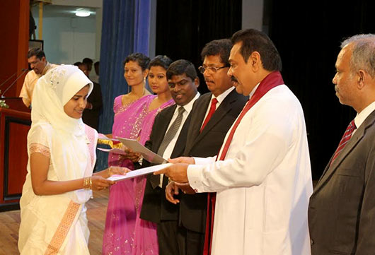 Handing over of letters of appointment to Banking Assistants newly recruited to the People’s Bank at the BMICH in Colombo by President Mahinda Rajapaksa