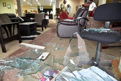 The windows of a showroom dealing in Sri Lankan furniture in Coimbatore were damaged in stone-throwing on Friday