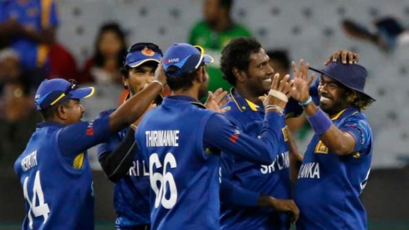 Sri Lanka's Lasith Malinga (R) celebrates with Cricket team mates