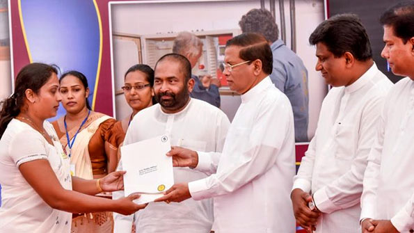 President Maithripala Sirisena hand over appointment letters to new employees of the Ceylon Electricity Board