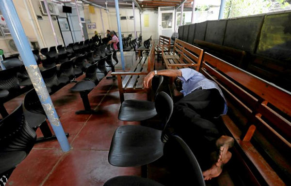 A patient sleeps on a chair in Colombo Sri Lanka