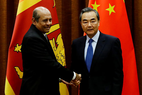 Sri Lanka's Foreign Minister Tilak Marapana and Chinese Foreign Minister Wang Yi