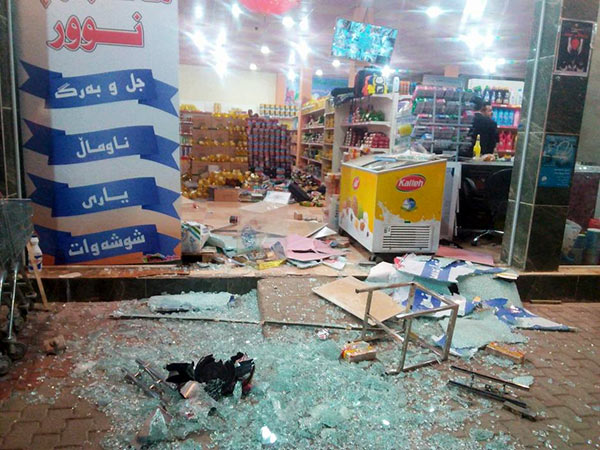 A damaged storefront is seen after an earthquake in Halabja, Iraq