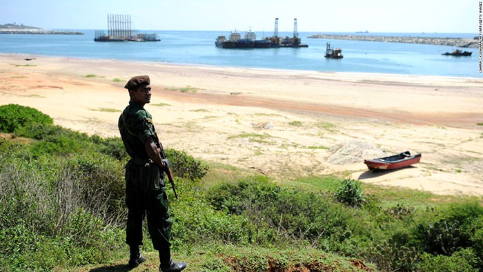 A Sri Lankan commando stands guard on the Hambantota construction site