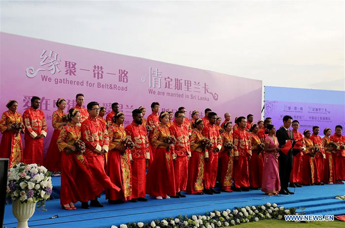 Sri Lankan and Chinese couples are seen during the mass wedding ceremony in Negombo, Sri Lanka