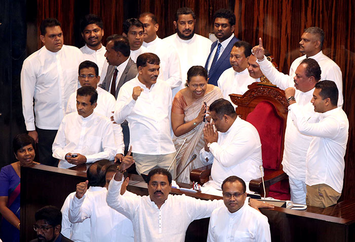 Arundika Fernando sits on the Speaker's chair in Parliament of Sri Lanka