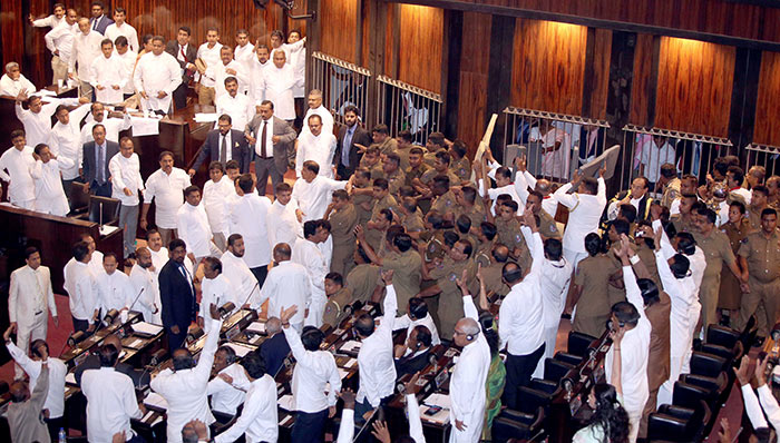 Sri Lanka police members protect Parliament Speaker Karu Jayasuriya in Parliament of Sri Lanka