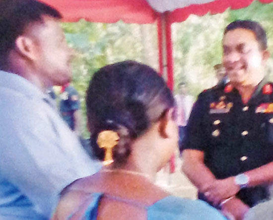 Jaffna Army Chief Major General Dharshana Hettiarachchi along with house recipient Randika Chaturanga and his wife.