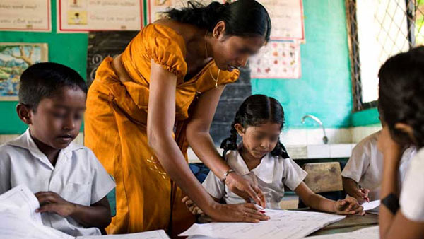 Sri Lankan teacher with children