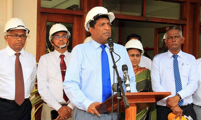 Ravi Karunanayake with electricity board officials in Sri Lanka