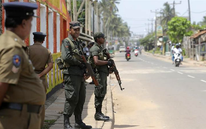 Sri Lankan army soldier stands guard