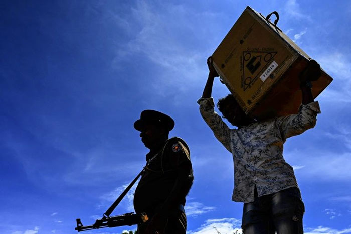 A man carrying a ballot box for election in Sri Lanka