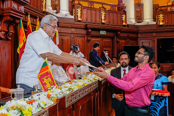 Sri Lanka President Gotabaya Rajapaksa handing over an Appointment letter to a graduate