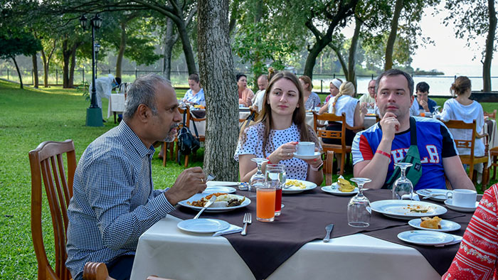 Udayanga Weeratunga with Ukrainian tourists in Sri Lanka