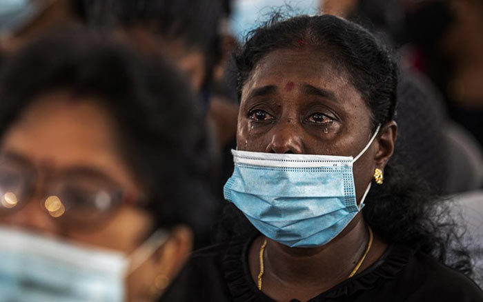 A Sri Lankan woman weeps during a memorial service for the victims of 2019 Easter Sunday attacks