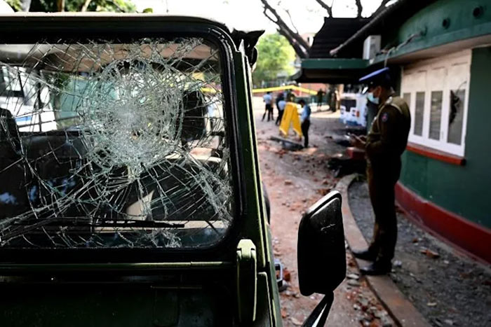 A damaged vehicle during a demonstration in Sri Lanka
