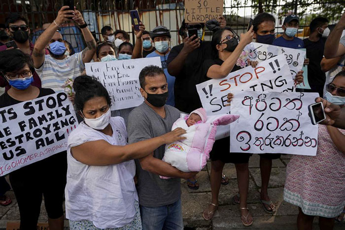 Couple with their infant join an anti government protest in Colombo, Sri Lanka
