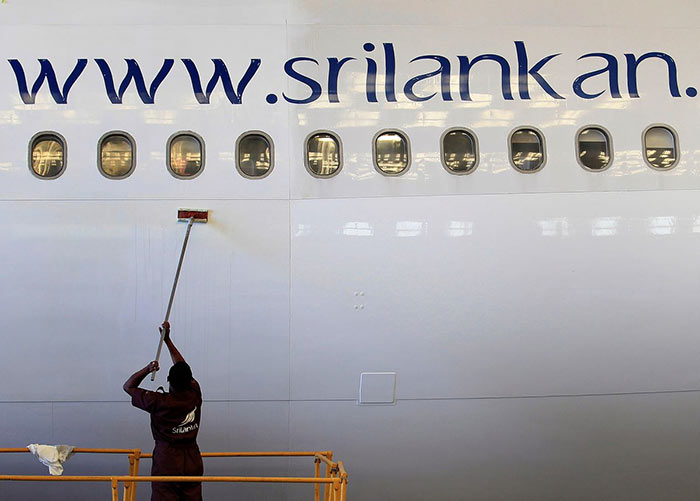 An Engineer cleans an airbus 340 at the Sri Lankan Airlines