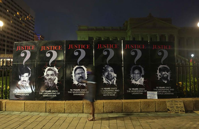 Portraits of journalists persecuted allegedly by Sri Lankan president Gotabaya Rajapaksa displayed outside the president's office in Colombo, Sri Lanka