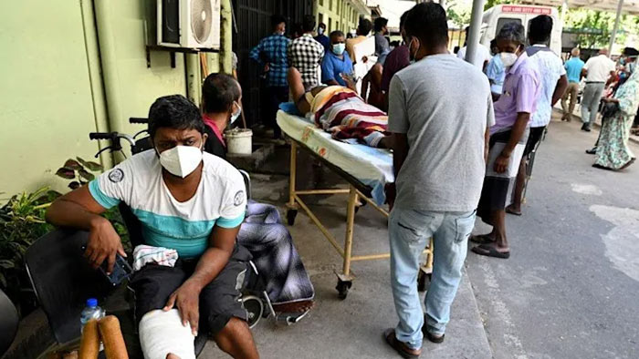 Patients wait for treatment at a Colombo hospital amid a health worker strike over shortages in February