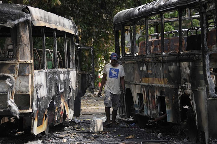 Burnt buses a day after clashes between Government supporters and anti-government protesters in Sri Lanka