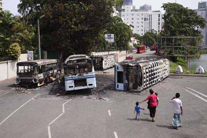 Burnt buses a day after clashes between Government supporters and anti-government protesters in Sri Lanka
