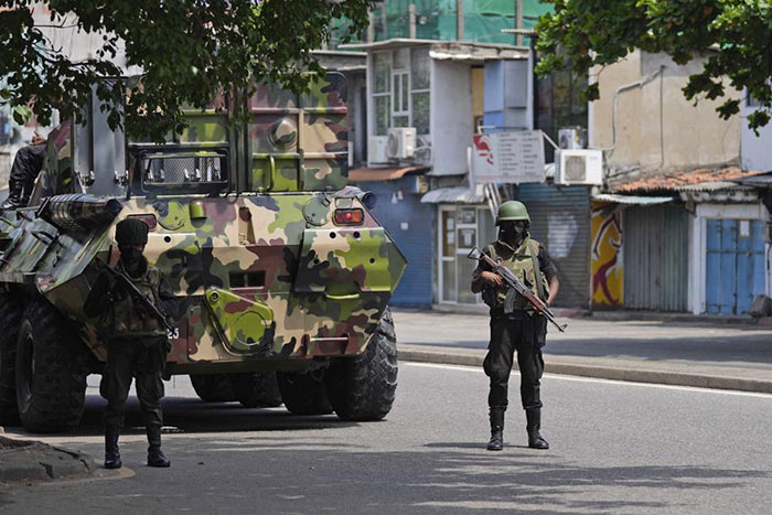 Sri Lankan Army soldiers patrol during curfew in Colombo, Sri Lanka