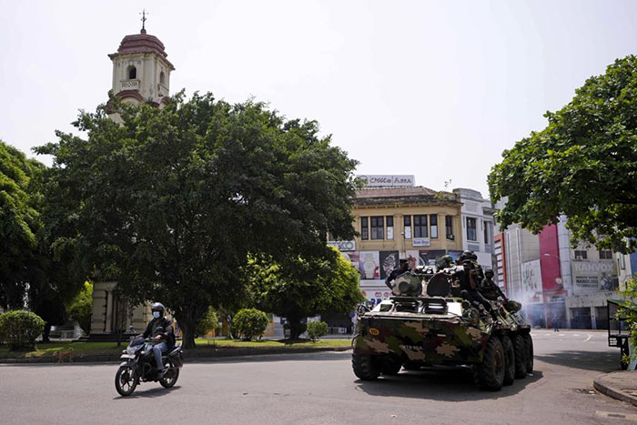 Sri Lankan Army soldiers patrol during curfew in Colombo, Sri Lanka