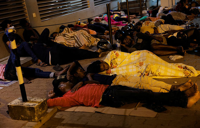 People sleep outside the Sri Lanka's Immigration and Emigration Department - Passport office Sri Lanka