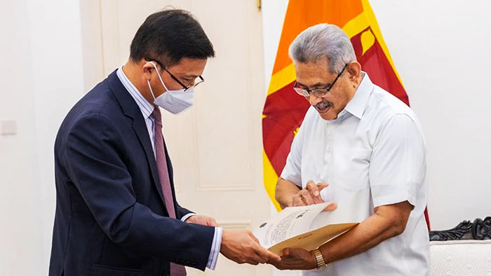 Chinese Ambassador to Sri Lanka Qi Zhenhong with Sri Lankan President Gotabaya Rajapaksa