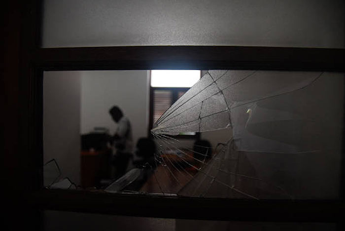 A damaged window of the Temple Trees in Colombo, Sri Lanka