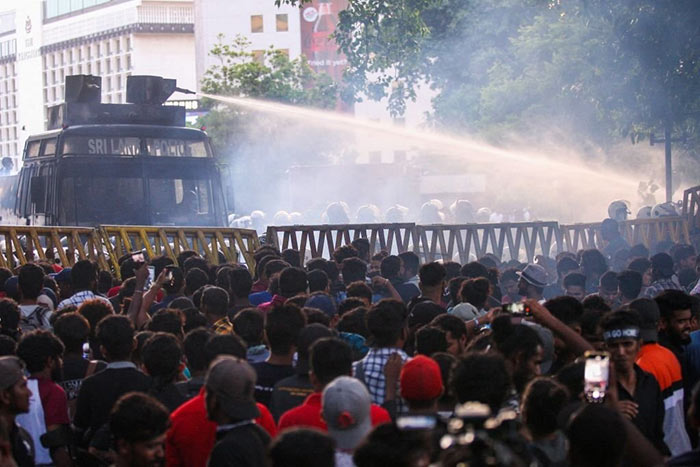 Sri Lanka Police use a water canon to disperse demonstrators