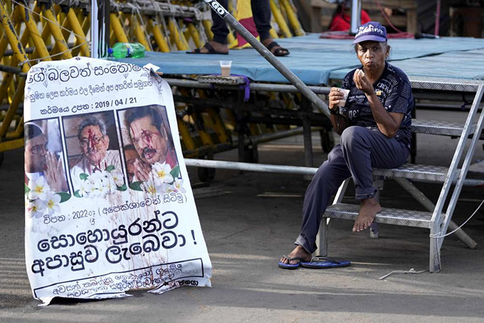 A Sri Lankan protester drinks a cup of tea
