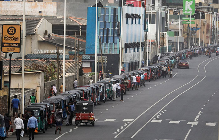 Three-wheelers queue to buy petrol in Colombo, Sri Lanka