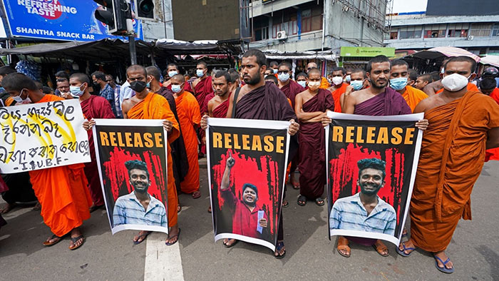 Sri Lankan University Buddhist monks take part in a demonstration against the Government