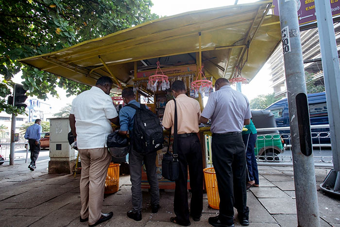 Morning commuters at a lottery ticket kiosk near World Trade Center in Colombo, Sri Lanka